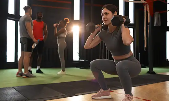 full-shot-people-training-together-gym